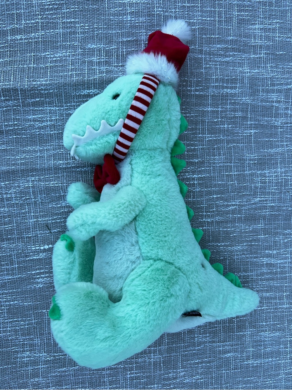 FAO Schwarz Mint Green Dinosaur Plush with Red Holiday Hat